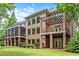 Charming brick home featuring multiple balconies and outdoor living spaces at 55 Moray Pl, Covington, GA 30014