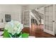Spacious foyer leading to a staircase and a study with French doors, offering a glimpse of interior design at 55 Moray Pl, Covington, GA 30014