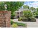 Impressive brick residence featuring manicured landscaping, a circular driveway, and an inviting entrance at 55 Moray Pl, Covington, GA 30014