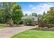 Beautiful home with brick accents, professional landscaping, and a charming entrance gate for added privacy at 55 Moray Pl, Covington, GA 30014