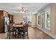 Kitchen area flows into the living room, with stainless steel appliances and lots of light at 55 Moray Pl, Covington, GA 30014