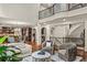 Open-concept living room with a view of the staircase and kitchen at 55 Moray Pl, Covington, GA 30014