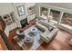 Bright and airy living room with a cozy fireplace and large windows offering natural light and lovely outdoor views at 55 Moray Pl, Covington, GA 30014