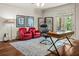Comfortable office with a desk, plush chairs, and French doors to let in natural light at 55 Moray Pl, Covington, GA 30014
