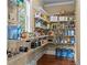 Walk-in pantry features custom shelving, providing ample storage space at 55 Moray Pl, Covington, GA 30014