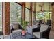 Relaxing screened porch with comfortable seating at 55 Moray Pl, Covington, GA 30014
