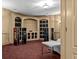 Well-appointed theater room featuring custom built-ins and high-end audio equipment for the ultimate home entertainment at 55 Moray Pl, Covington, GA 30014