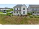 Aerial view of a charming two-story home with manicured lawn and dark-stained perimeter fencing at 6320 Halcyon Garden Dr, Alpharetta, GA 30005