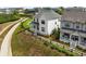 Aerial view of a charming two-story home with manicured lawn and dark-stained perimeter fencing at 6320 Halcyon Garden Dr, Alpharetta, GA 30005
