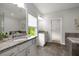 This bathroom features a granite-topped vanity, a soaking tub, and a glass enclosed shower at 6320 Halcyon Garden Dr, Alpharetta, GA 30005