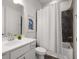 Clean bathroom featuring a vanity, toilet, shower and tub combination with stylish tile and a calming ambiance at 6320 Halcyon Garden Dr, Alpharetta, GA 30005