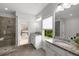 Bathroom with granite countertops, gray tile flooring, and a glass shower at 6320 Halcyon Garden Dr, Alpharetta, GA 30005