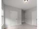 The empty room has three doors at 6320 Halcyon Garden Dr, Alpharetta, GA 30005