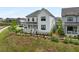 Beautiful two-story home with a covered porch, set on a landscaped lot with a charming black fence at 6320 Halcyon Garden Dr, Alpharetta, GA 30005