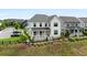 Charming two-story home with a welcoming front porch and well-manicured lawn, perfect for curb appeal at 6320 Halcyon Garden Dr, Alpharetta, GA 30005