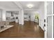 Spacious foyer with hardwood floors, views of the kitchen, dining room, and living area at 6320 Halcyon Garden Dr, Alpharetta, GA 30005