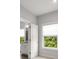 Hallway view of bathroom and bedroom with window at 6320 Halcyon Garden Dr, Alpharetta, GA 30005
