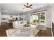Bright, open living area seamlessly connects kitchen, living room, and outdoor space, ideal for modern living at 6320 Halcyon Garden Dr, Alpharetta, GA 30005