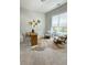 Bright home office with a modern desk, cozy seating, and large window, creating a comfortable workspace at 6320 Halcyon Garden Dr, Alpharetta, GA 30005