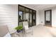 Outdoor patio with seating, sliding glass doors, and additional door for easy access at 6320 Halcyon Garden Dr, Alpharetta, GA 30005