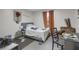 Cozy bedroom with natural light, comfortable bed, and a view of the outside scenery at 652 Post Oak Rd, Jonesboro, GA 30238