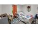 Bedroom features a comfortable bed, side tables, window, and decorative wall art at 652 Post Oak Rd, Jonesboro, GA 30238