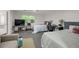 Expansive bedroom showcases two beds, seating area, and large window offering ample natural light at 652 Post Oak Rd, Jonesboro, GA 30238