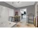 View of dining room reveals table and chairs, leading to a well-equipped kitchen in the distance at 652 Post Oak Rd, Jonesboro, GA 30238