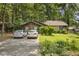 Inviting single-story home with a charming facade and well-maintained front yard and ample parking space at 652 Post Oak Rd, Jonesboro, GA 30238