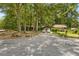 Charming single-story home nestled among mature trees with a spacious driveway at 652 Post Oak Rd, Jonesboro, GA 30238