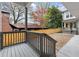 Back deck featuring gray railings and a view of the fenced backyard at 779-A Lynwood Se St, Atlanta, GA 30312
