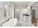 Bright bathroom featuring a freestanding tub, and large windows at 779-A Lynwood Se St, Atlanta, GA 30312