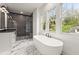 Bathroom featuring a freestanding tub, walk-in shower, and double vanity at 779-A Lynwood Se St, Atlanta, GA 30312