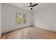 Bright bedroom featuring neutral paint, hardwood floors, and a modern ceiling fan at 779-A Lynwood Se St, Atlanta, GA 30312