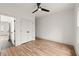 Bright bedroom featuring neutral paint, hardwood floors, a modern ceiling fan, and closet at 779-A Lynwood Se St, Atlanta, GA 30312