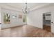 Bright bedroom with hardwood floors, tray ceiling, modern light fixture and walk-in closet at 779-A Lynwood Se St, Atlanta, GA 30312