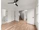 Open bedroom features a ceiling fan, hardwood floors, and multiple entrances at 779-A Lynwood Se St, Atlanta, GA 30312