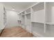Spacious walk-in closet with custom shelving and wooden floors, providing ample storage at 779-A Lynwood Se St, Atlanta, GA 30312
