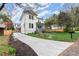 Long driveway leads to a well-maintained home with fresh landscaping and a spacious front yard at 779-A Lynwood Se St, Atlanta, GA 30312