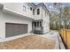 Beautiful home features a two-car garage, brick parking pad and tidy landscaping at 779-A Lynwood Se St, Atlanta, GA 30312