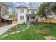 Beautiful two-story home boasts a manicured lawn and attractive landscaping that enhances its curb appeal at 779-A Lynwood Se St, Atlanta, GA 30312