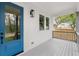 Charming front porch with a blue door, offering a warm welcome and a view of the outdoors at 779-A Lynwood Se St, Atlanta, GA 30312