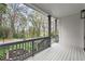 Inviting front porch with wood flooring and trim, offering a view of the surrounding landscape at 779-A Lynwood Se St, Atlanta, GA 30312
