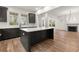 Open concept kitchen with island and hardwood floors that flows into the living area at 779-A Lynwood Se St, Atlanta, GA 30312