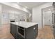 Open concept kitchen island with built in microwave and hardwood floors at 779-A Lynwood Se St, Atlanta, GA 30312