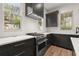 Bright kitchen with stainless steel oven, white countertops, and a modern range hood at 779-A Lynwood Se St, Atlanta, GA 30312