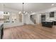 Stylish living room with hardwood floors, modern lighting, and black and white accents at 779-A Lynwood Se St, Atlanta, GA 30312
