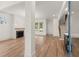 Bright living room with fireplace, hardwood floors, and a view of the staircase, creating an inviting space at 779-A Lynwood Se St, Atlanta, GA 30312