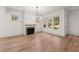 Bright living room with hardwood floors, gas fireplace, and many windows overlooking the backyard at 779-A Lynwood Se St, Atlanta, GA 30312