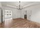 Large main bedroom suite features hardwood floors, doors to bathroom and access to upstairs area at 779-A Lynwood Se St, Atlanta, GA 30312